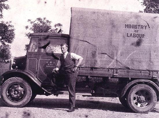 John Lunn with labour camp lorry