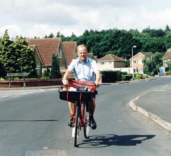 Postman Alan Bottomley on his rounds in 2001